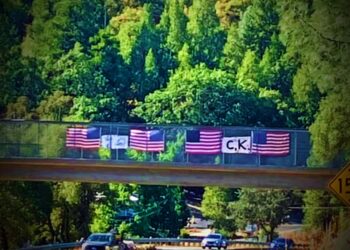 Memorial to Charlie Kirk Vandalized on Camino Overpass; Flags Cut, Signs Damaged