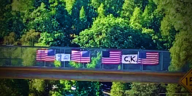 Memorial to Charlie Kirk Vandalized on Camino Overpass; Flags Cut, Signs Damaged